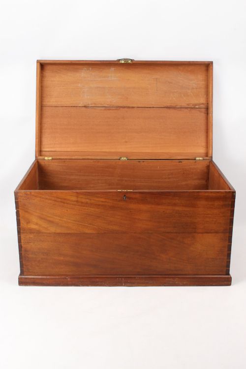 fig 1. A rectangular Victorian mahogany storage chest featuring exposed dovetail corner joints, a flat hinged lid, and a central brass handle.