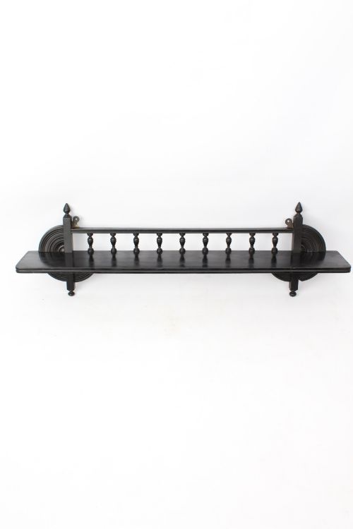 fig 1. An ebonised wooden hanging wall shelf featuring a low spindle balustrade rail, turned finials, and decorative corner mouldings.