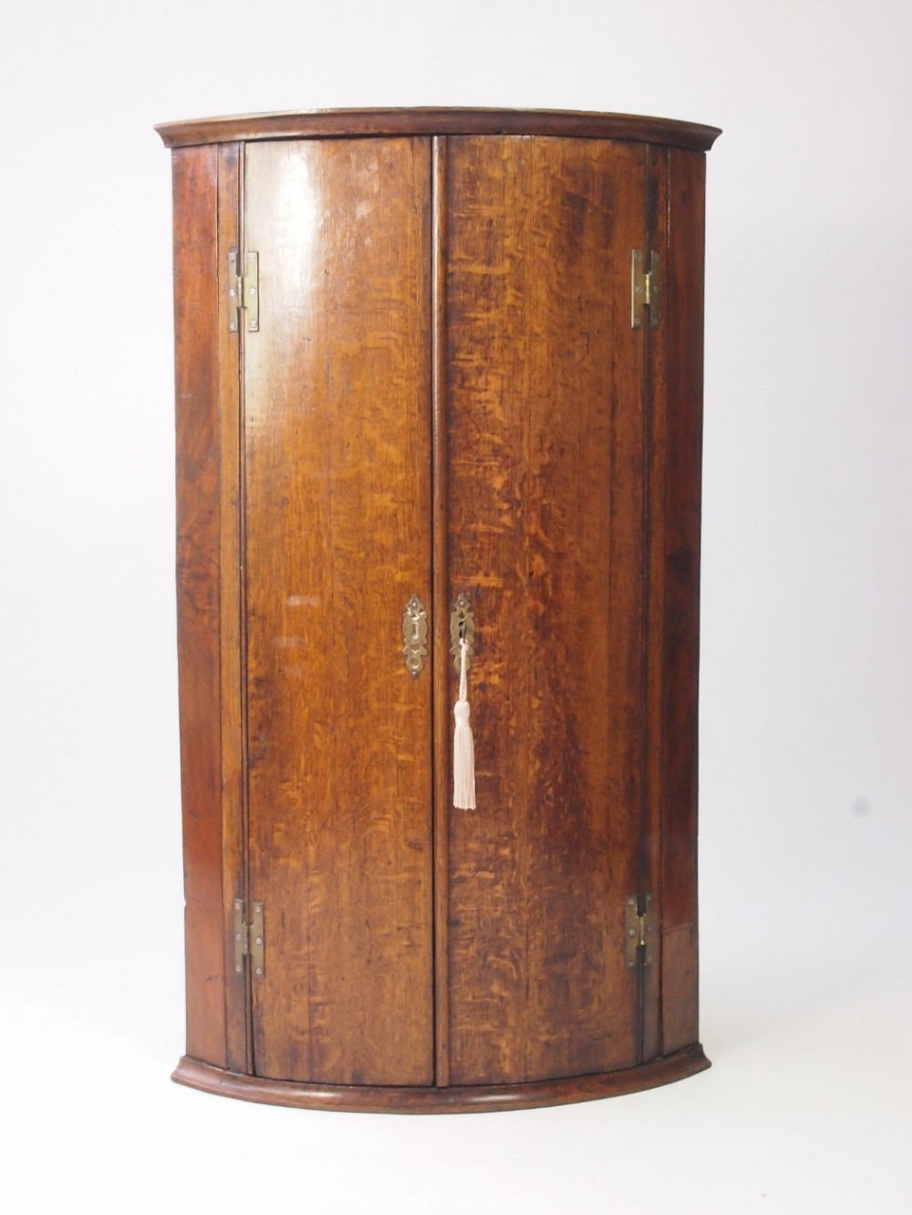 Slim Georgian Bow Fronted Oak Corner Cupboard