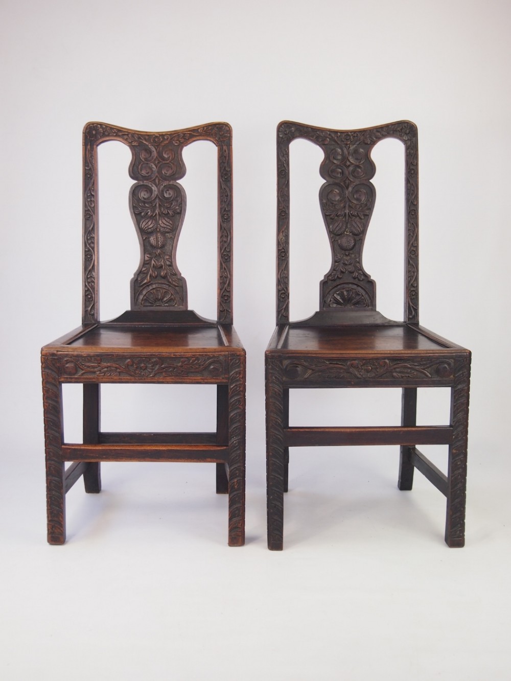 Pair Georgian and Later Carved Oak Hall Chairs