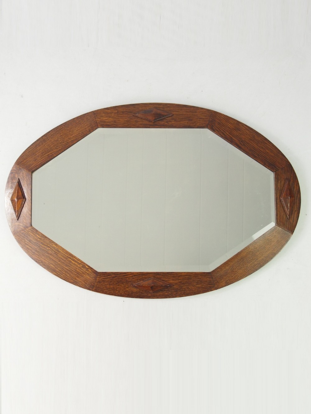 Hexagonal Mirror in an Oval Oak Frame