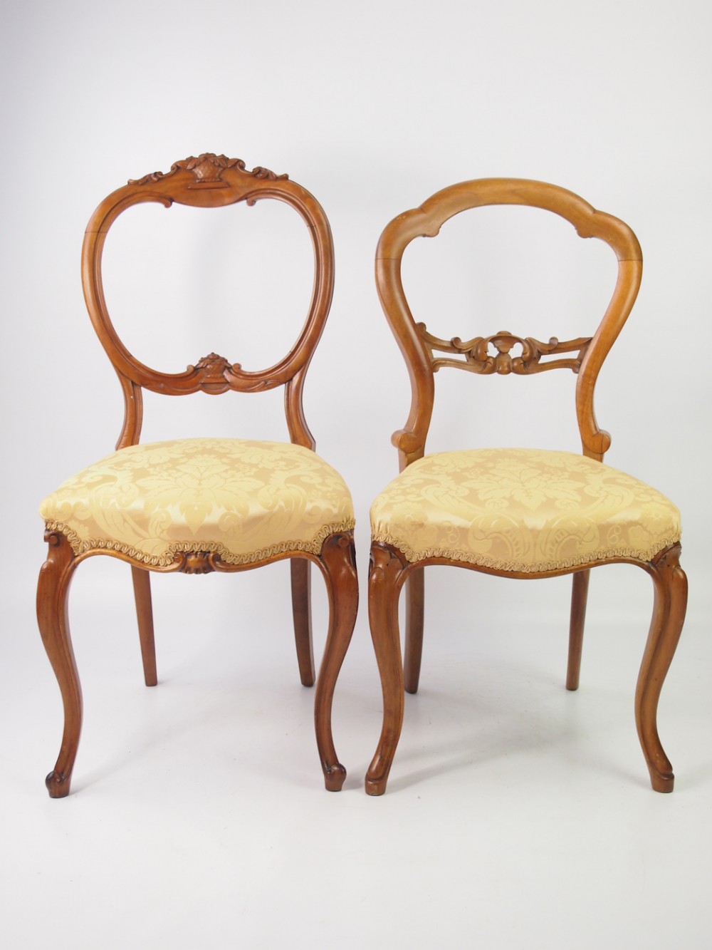 Two Victorian Walnut Balloon Back Chairs