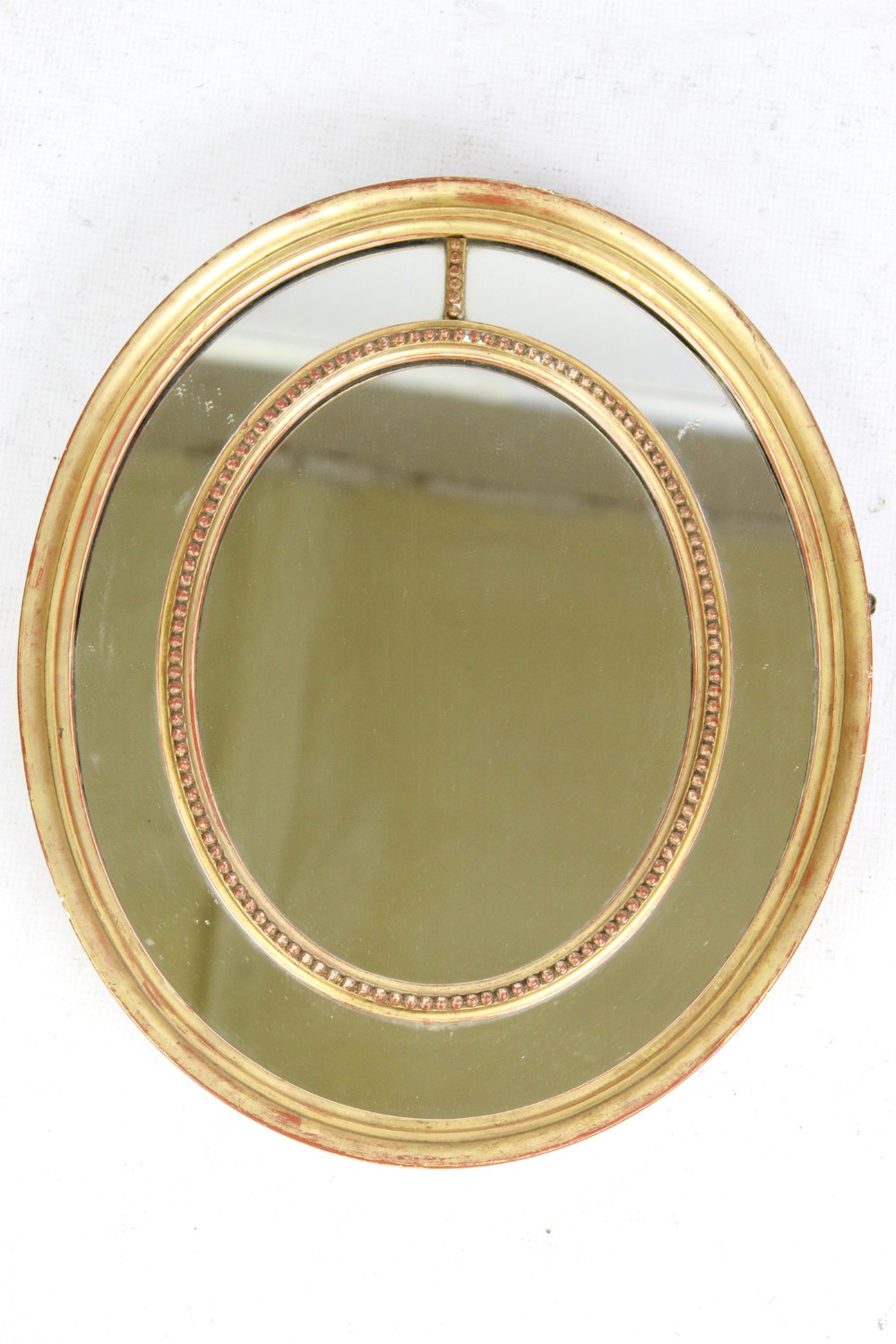 Small Victorian Gilt Sectional Oval Wall Mirror