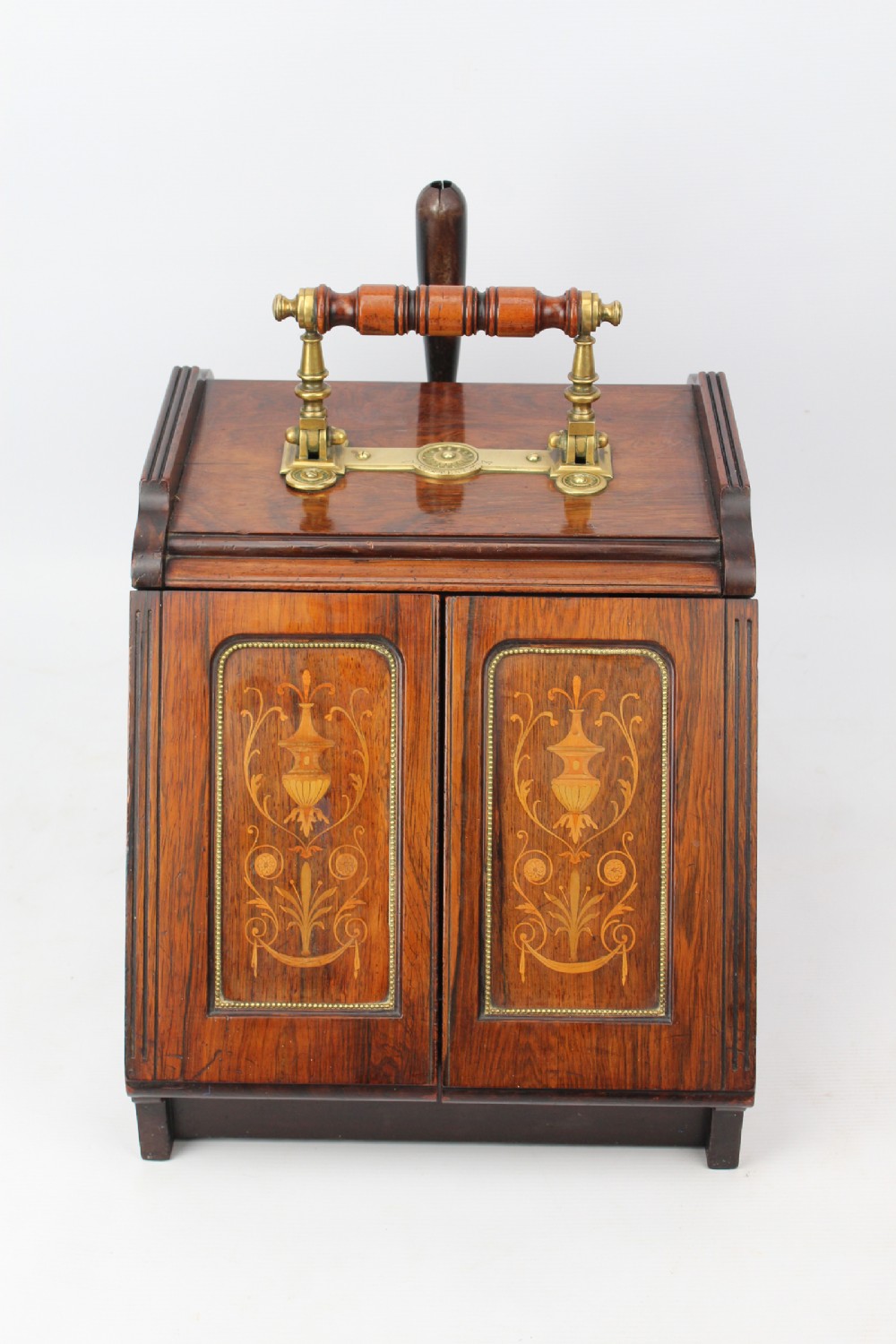 A Victorian rosewood metamorphic coal purdonium featuring urn marquetry inlays on front doors and a turned brass handle on top.