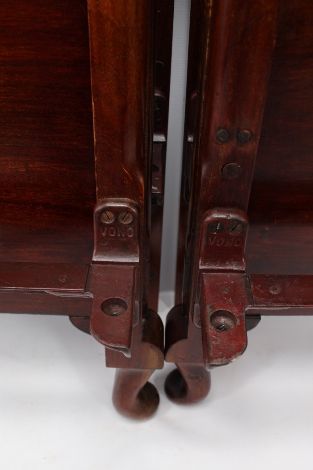 A matching pair of Art Deco mahogany single beds with stepped, arched headboards and low footboards on short cabriole feet. View VI