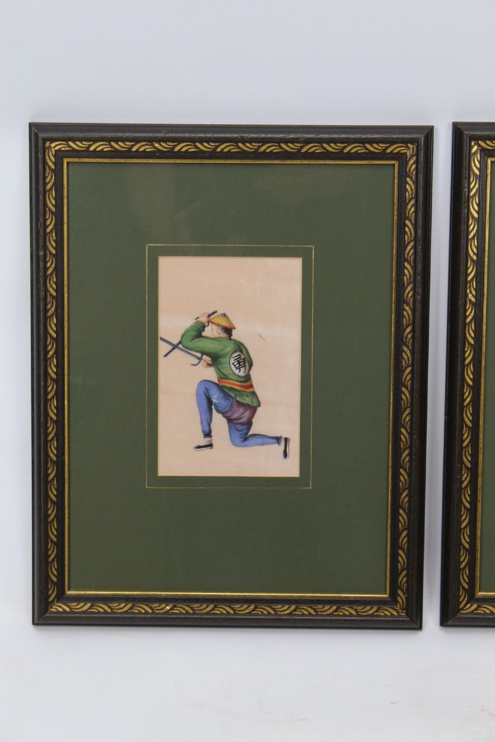 A pair of small framed antique Chinese watercolour paintings on pith paper, set in dark green mounts with gilded decorative frames. View II