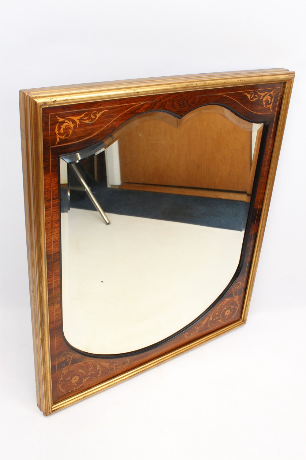 A rectangular rosewood wall mirror featuring gilt outer moulding, floral corner marquetry inlays, and an arched bevelled glass plate. View III