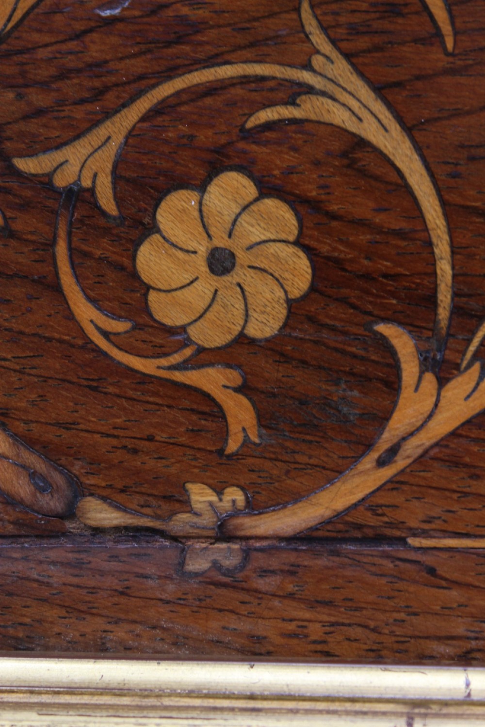 A rectangular rosewood wall mirror featuring gilt outer moulding, floral corner marquetry inlays, and an arched bevelled glass plate. View VII