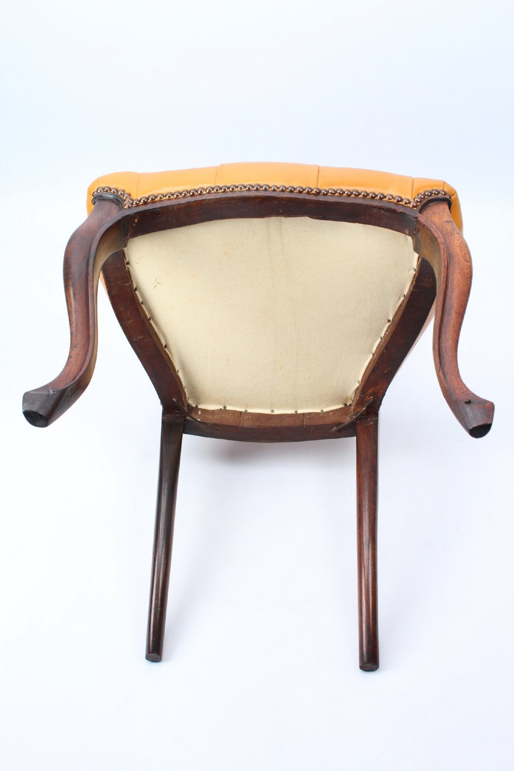 A pair of Victorian rosewood balloon back side chairs featuring button-tufted tan leather upholstery and cabriole front legs. View XII