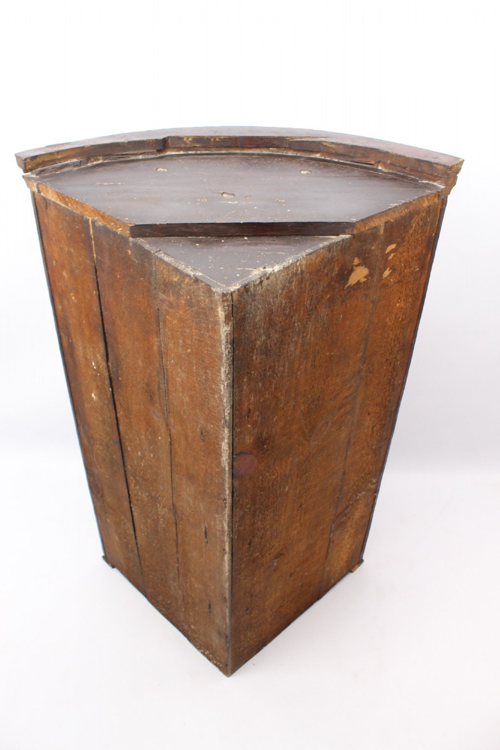 A Georgian oak bow-front corner cupboard with twin doors, exposed brass H-hinges, crossbanded veneer borders, and central brass escutcheons. View XIII