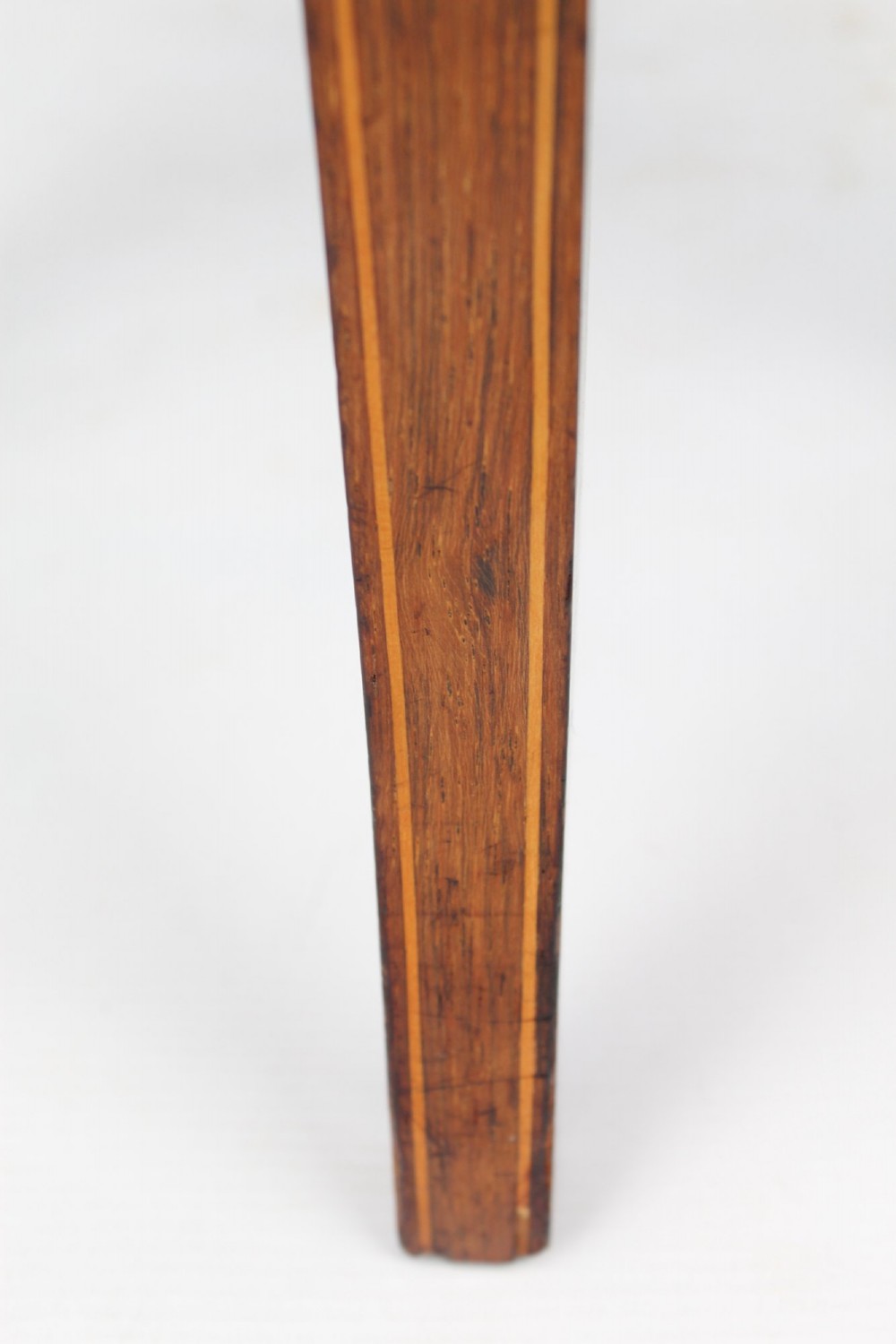 A circular padded beige stool on a dark rosewood base featuring floral marquetry and curved legs. View VII