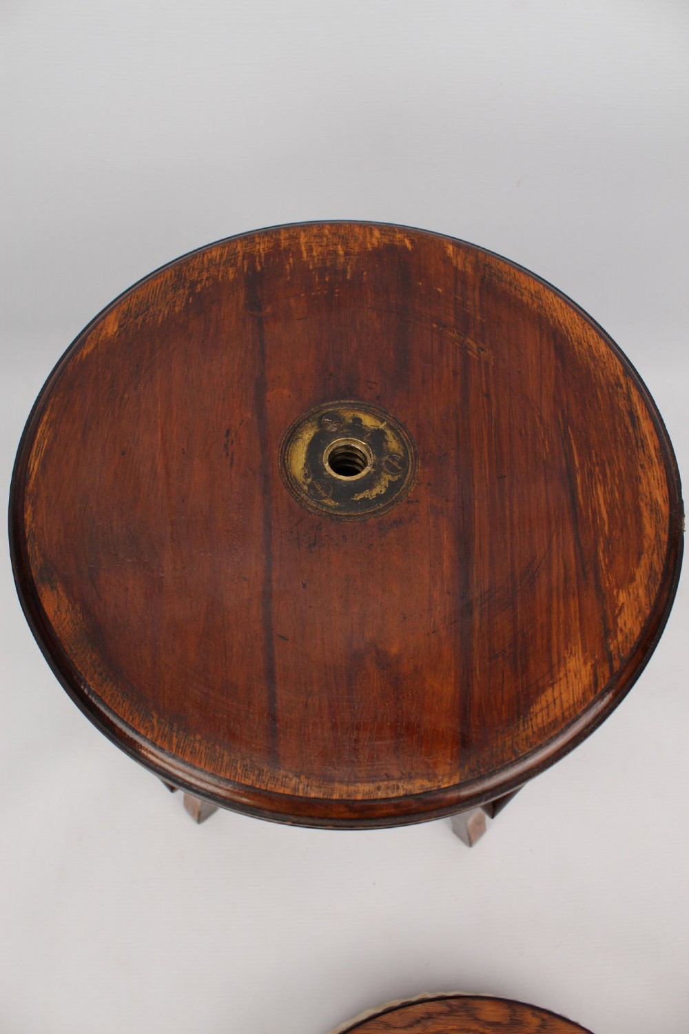 A circular padded beige stool on a dark rosewood base featuring floral marquetry and curved legs. View XI