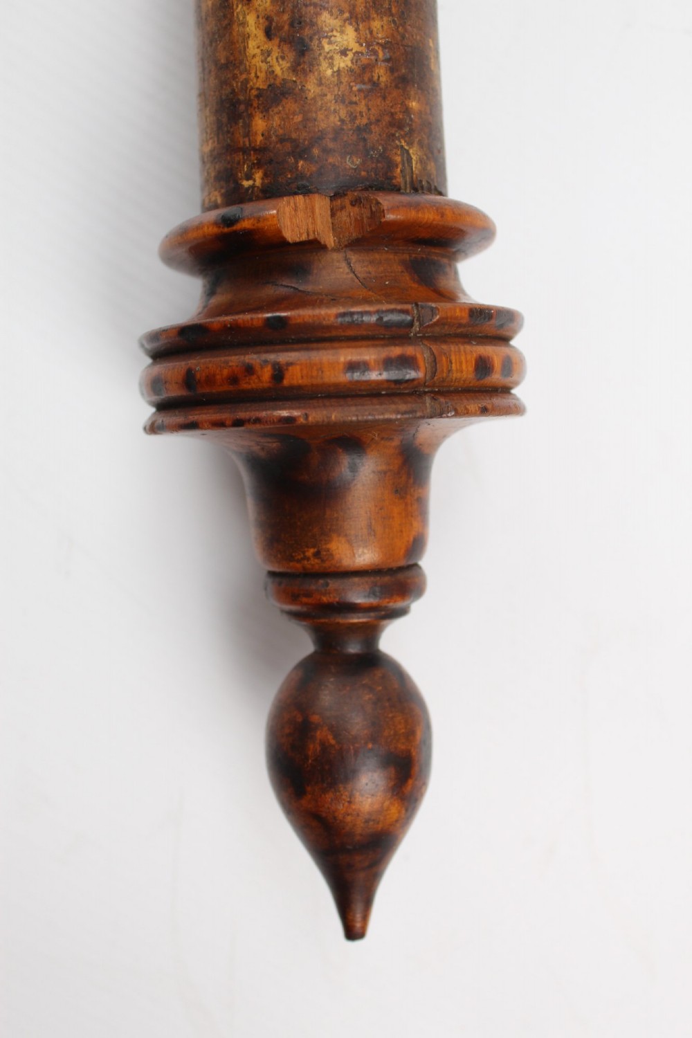 A long natural bamboo curtain pole featuring turned wooden finials at both ends and a set of matching wooden curtain rings stacked near one end. View XI