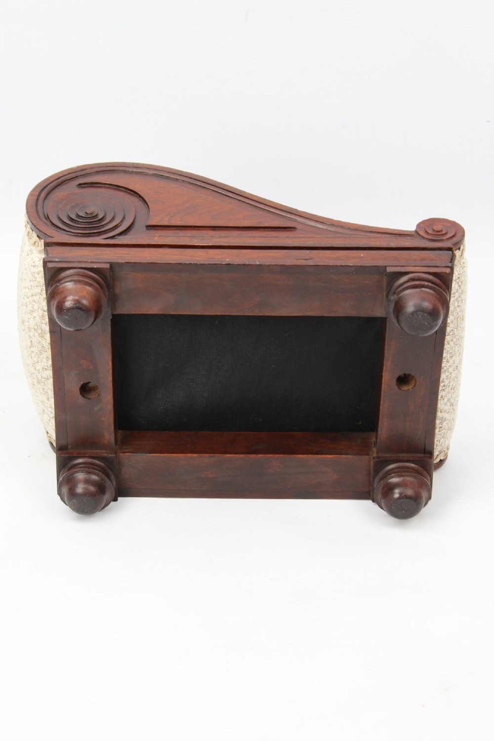 An inclined Regency rosewood footstool featuring carved side scrolls, turned bun feet, and cream textured upholstery finished with gimp braid. View IX