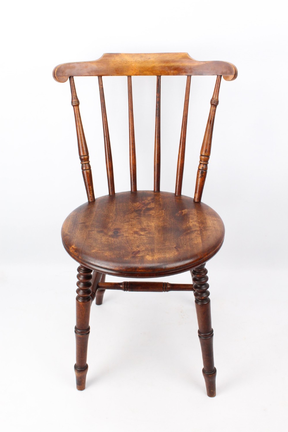 A pair of warm brown wooden kitchen chairs featuring spindle backs, turned legs, and solid timber seats. View II