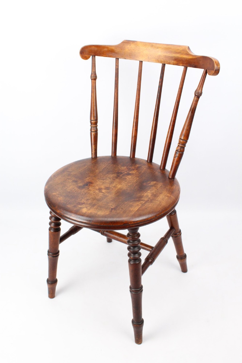 A pair of warm brown wooden kitchen chairs featuring spindle backs, turned legs, and solid timber seats. View III