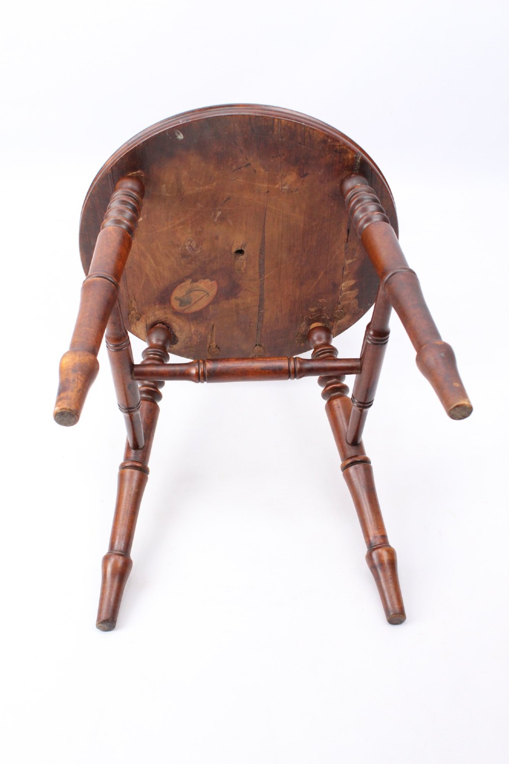 A pair of warm brown wooden kitchen chairs featuring spindle backs, turned legs, and solid timber seats. View VI