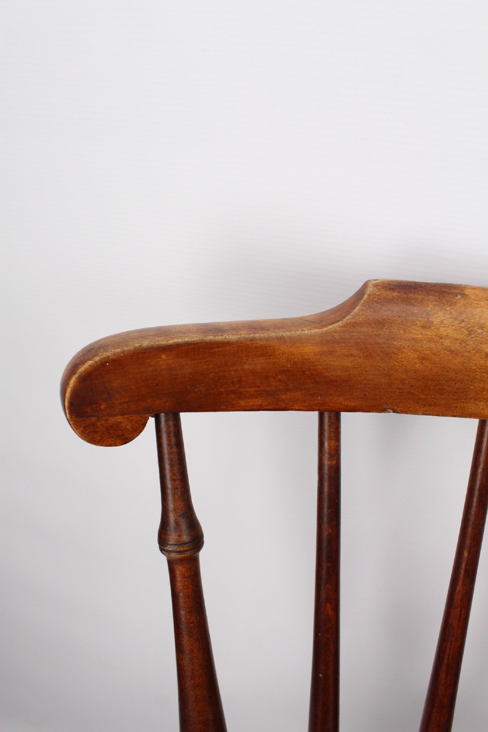 A pair of warm brown wooden kitchen chairs featuring spindle backs, turned legs, and solid timber seats. View IX