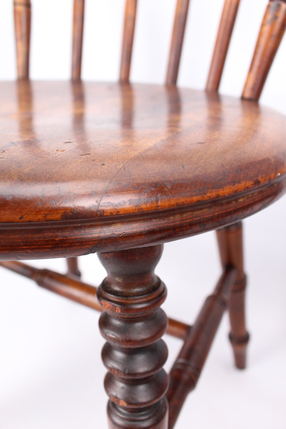 A pair of warm brown wooden kitchen chairs featuring spindle backs, turned legs, and solid timber seats. View XI