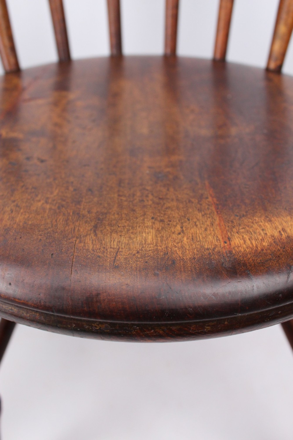 A pair of warm brown wooden kitchen chairs featuring spindle backs, turned legs, and solid timber seats. View XIII