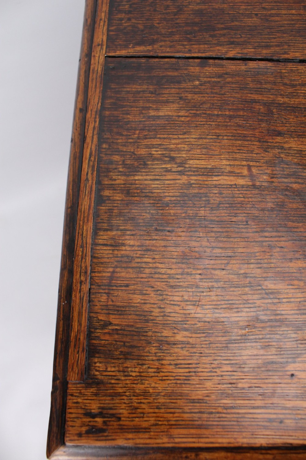 A low Georgian oak cupboard featuring two frieze drawers with turned wooden knobs above a pair of panelled cupboard doors. View X