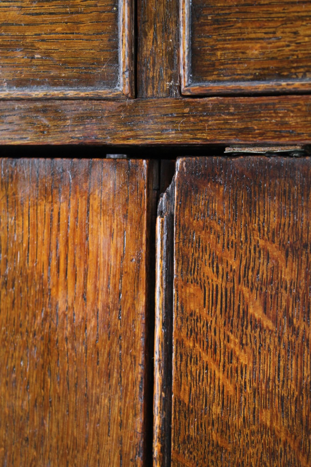 A low Georgian oak cupboard featuring two frieze drawers with turned wooden knobs above a pair of panelled cupboard doors. View XII