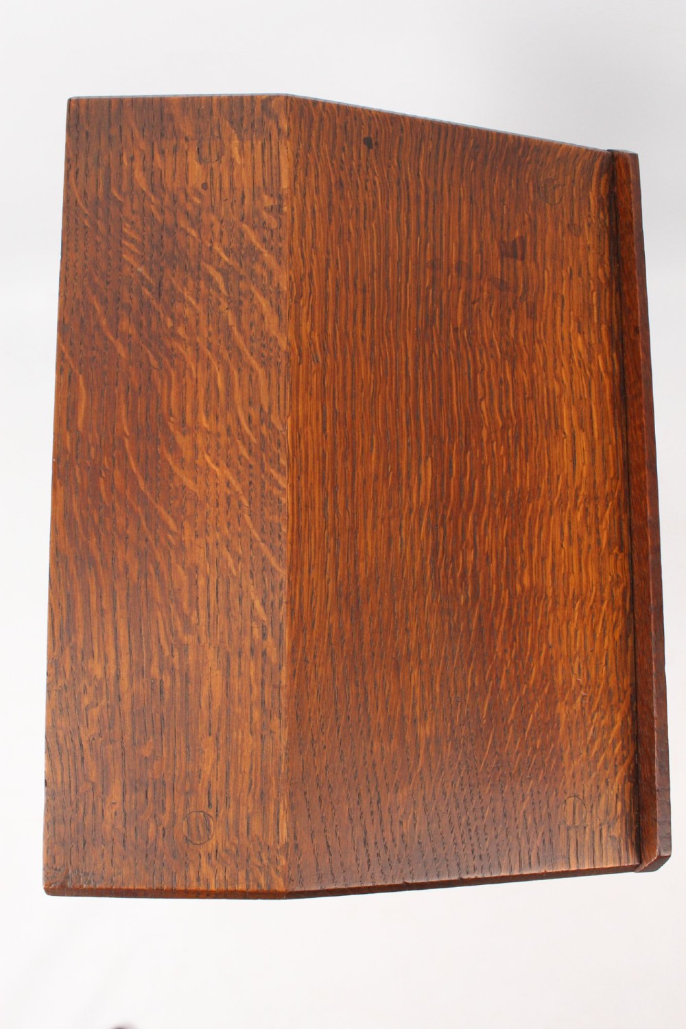 An Edwardian Arts and Crafts solid oak lectern featuring an angled reading top, an open middle shelf, and visible wedge tenon joinery. View VII