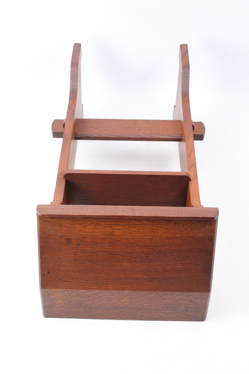 An Edwardian Arts and Crafts solid oak lectern featuring an angled reading top, an open middle shelf, and visible wedge tenon joinery. View XII