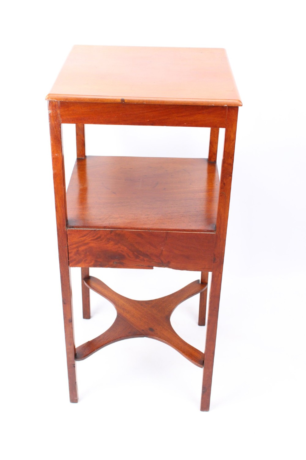 A two-tier Georgian mahogany bedside table with a single drawer, square top, and curved X-form stretcher. View V