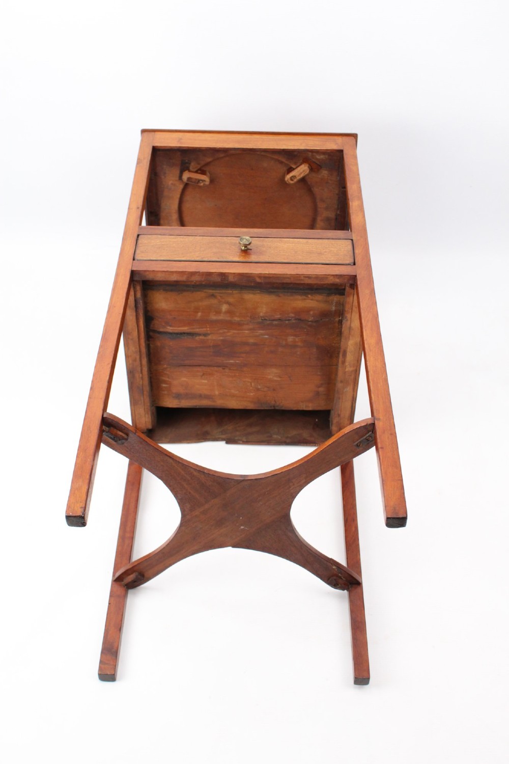 A two-tier Georgian mahogany bedside table with a single drawer, square top, and curved X-form stretcher. View XIII