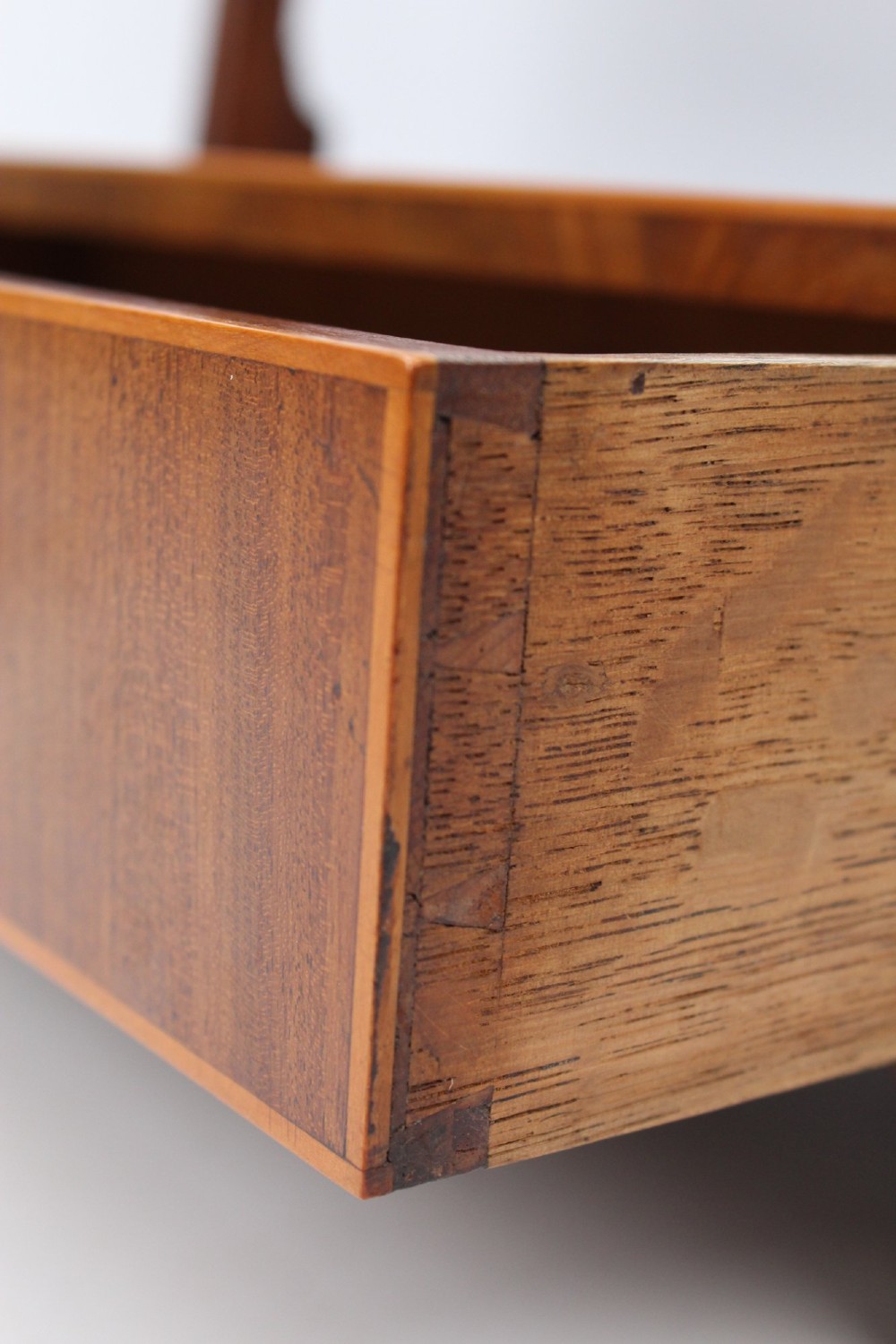 An antique Regency mahogany toilet mirror featuring an adjustable rectangular mirror set between turned upright posts above a single drawer base. View VI