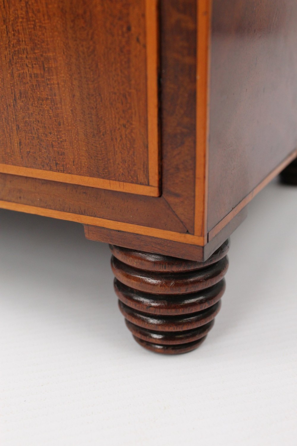 An antique Regency mahogany toilet mirror featuring an adjustable rectangular mirror set between turned upright posts above a single drawer base. View VIII