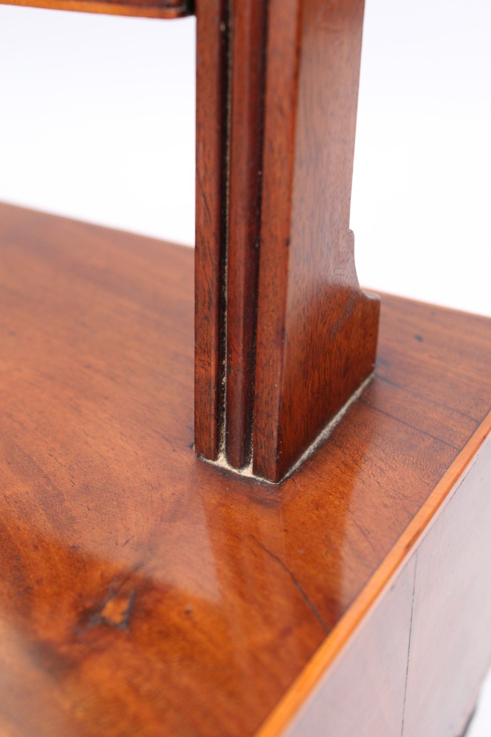 An antique Regency mahogany toilet mirror featuring an adjustable rectangular mirror set between turned upright posts above a single drawer base. View X