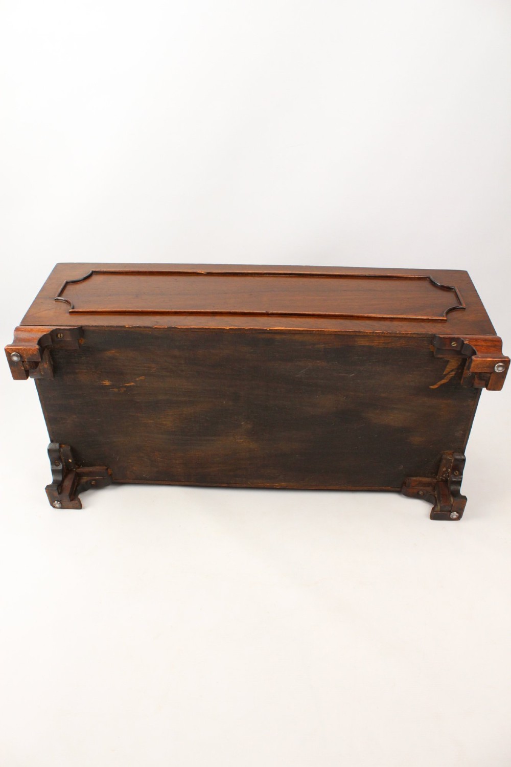 A low rectangular dark mahogany storage ottoman featuring a beige upholstered top with floral needlework embroidery. View X