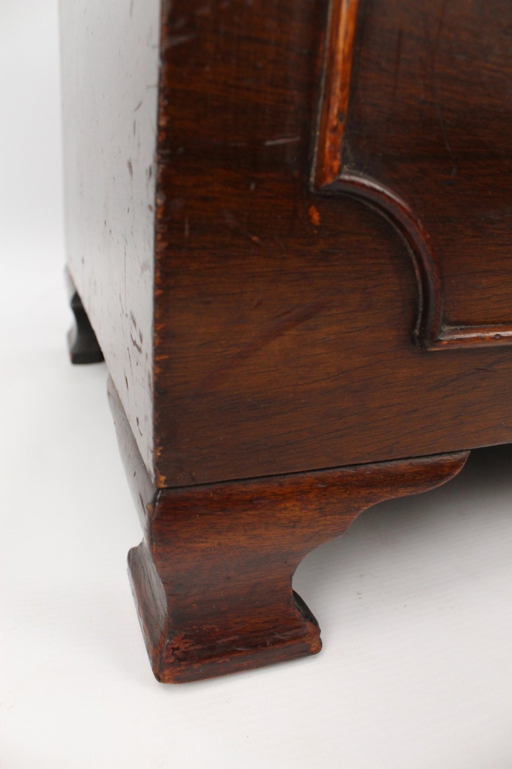 A low rectangular dark mahogany storage ottoman featuring a beige upholstered top with floral needlework embroidery. View XII