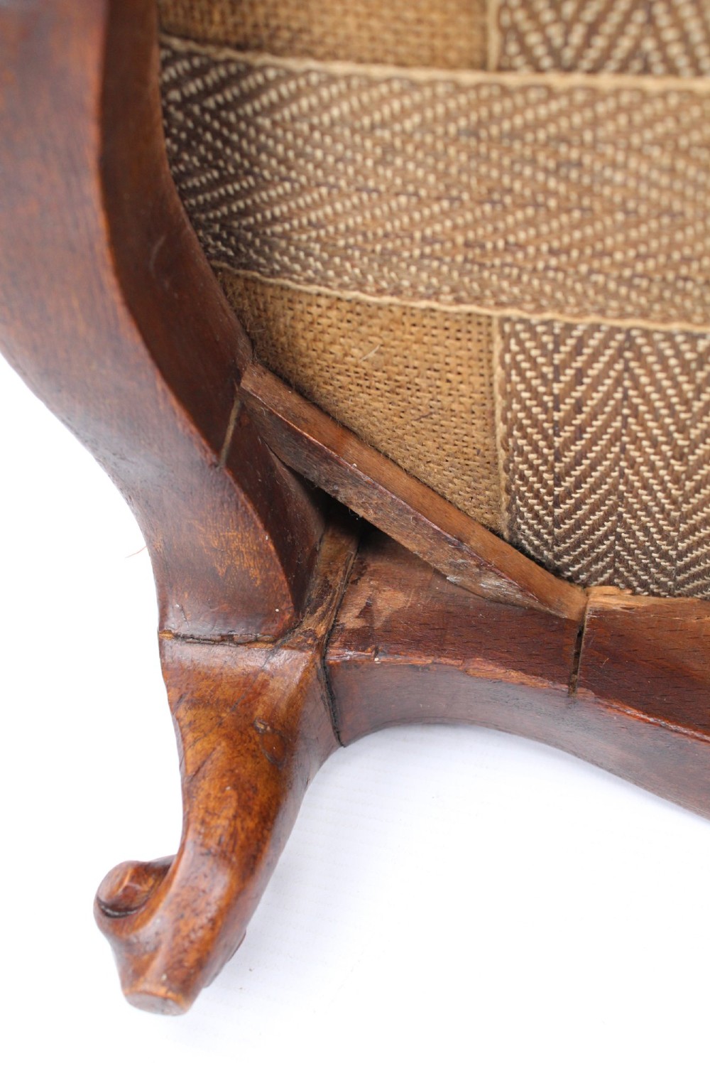 A pair of small Victorian footstools featuring crimson red velvet upholstery and carved walnut cabriole feet. View IX