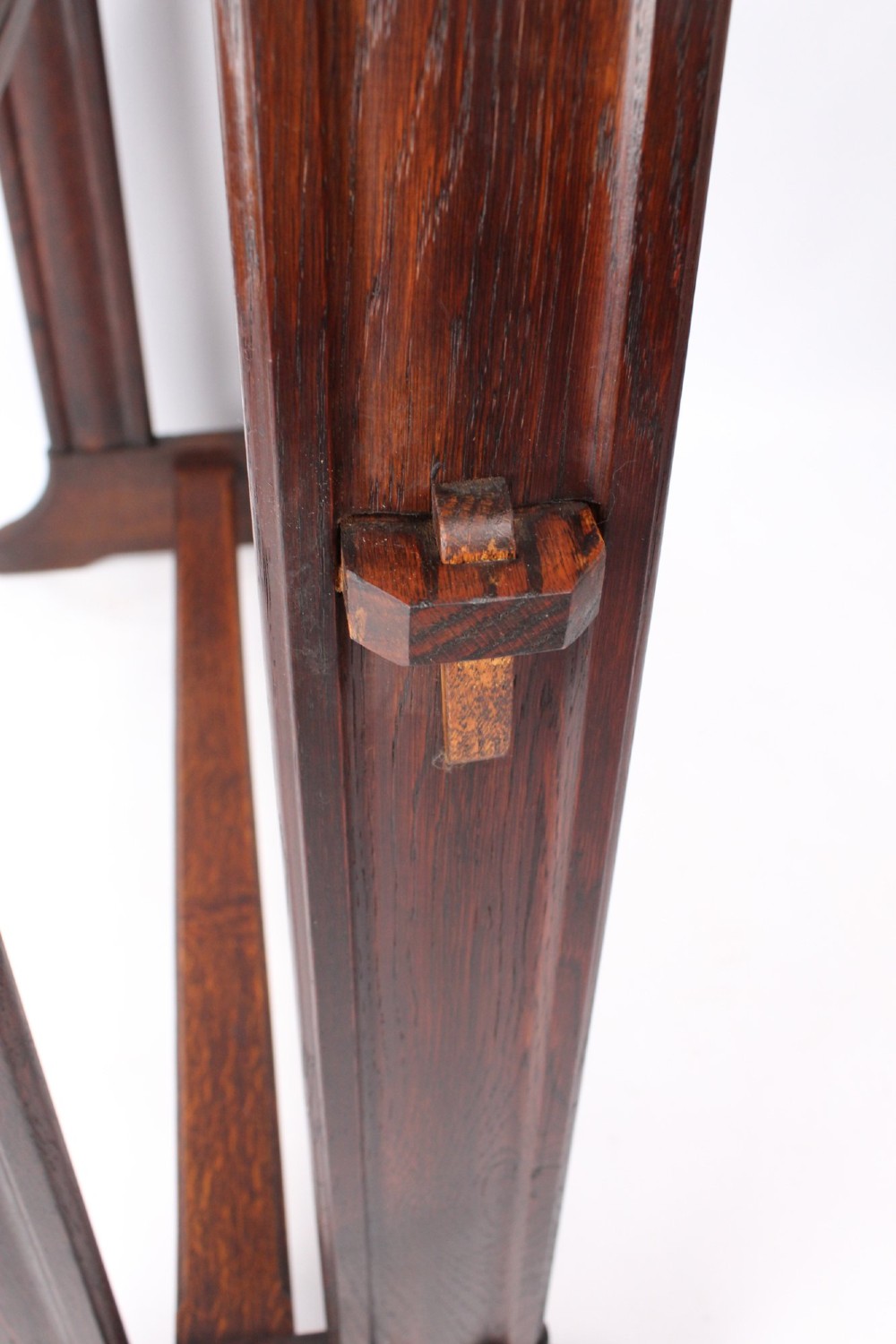 An Edwardian Arts and Crafts medium brown oak side table featuring double upright supports, exposed joint details, and a low stretcher. View VI