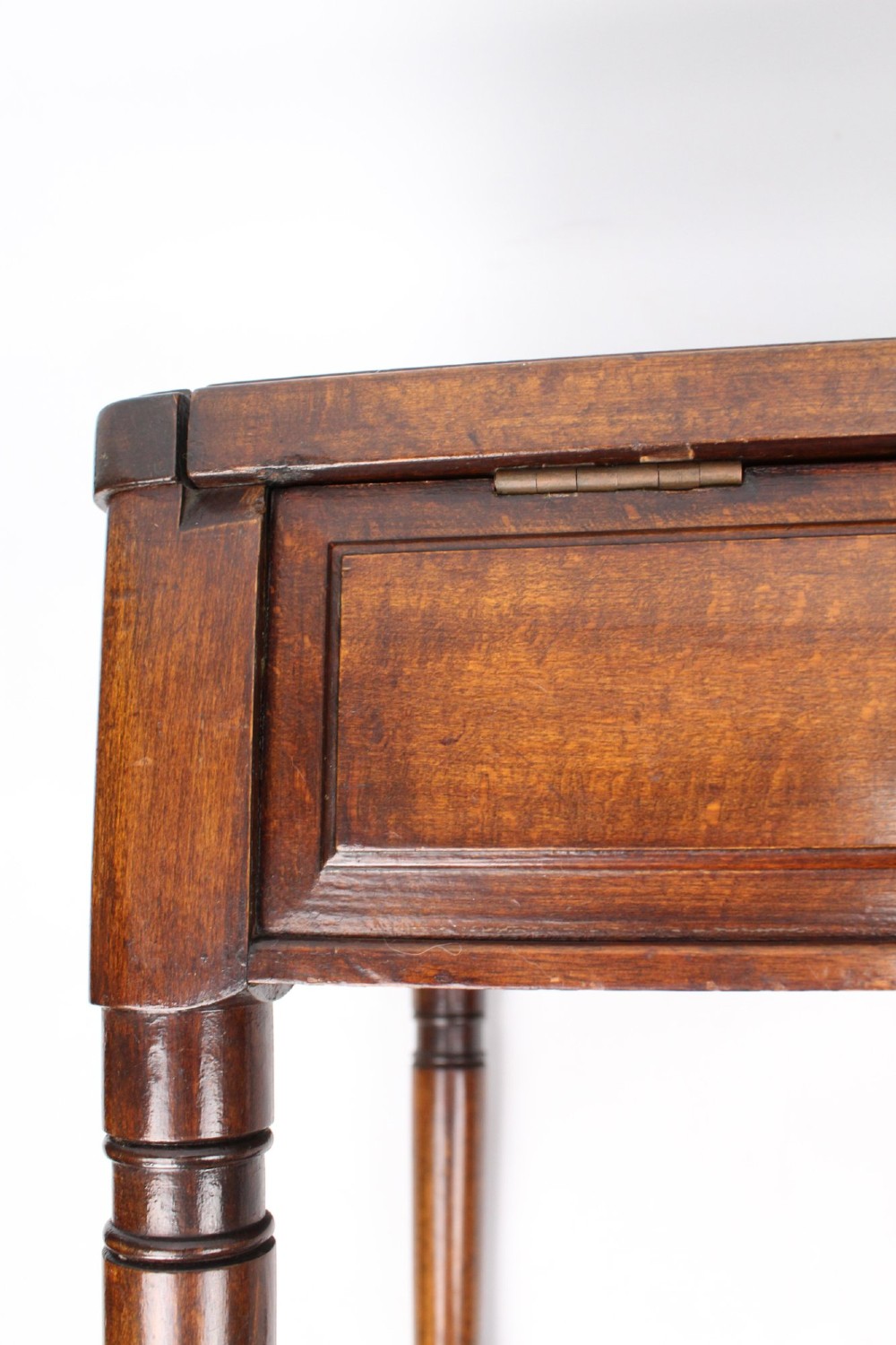 An Edwardian wooden duet piano stool featuring an olive green velvet upholstered seat and slender tapered legs. View X
