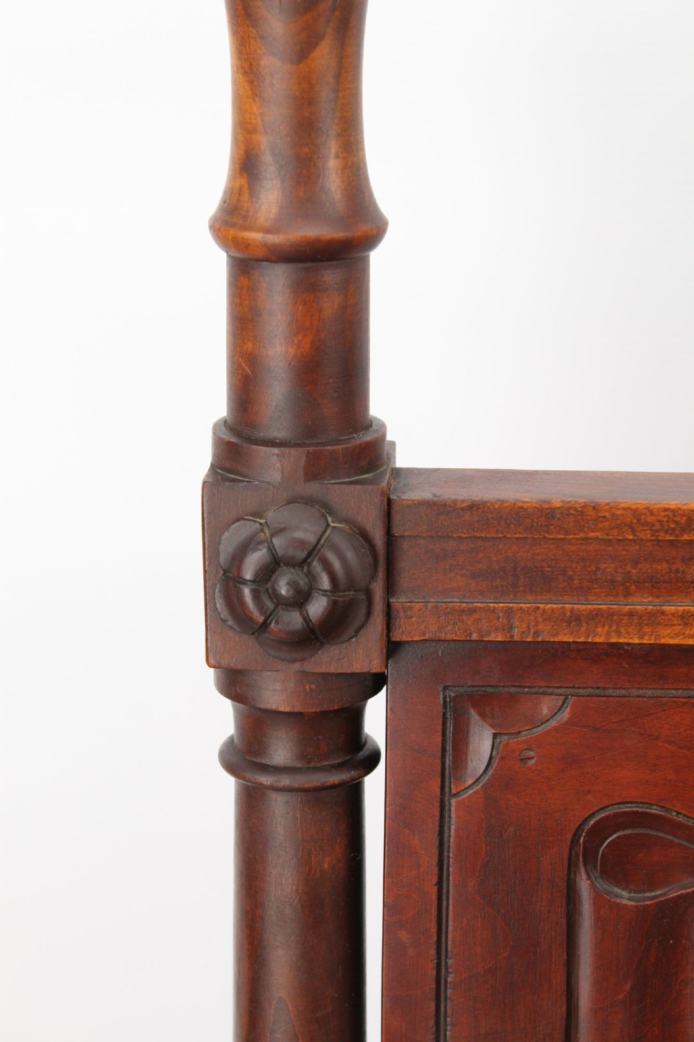 A Victorian Gothic Revival side chair made of dark oak with turned finials, a carved rectangular back panel, pointed arch aprons, and a woven rush seat. View IX