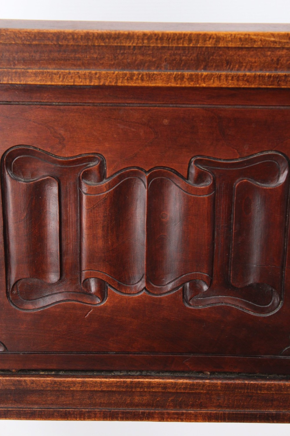 A Victorian Gothic Revival side chair made of dark oak with turned finials, a carved rectangular back panel, pointed arch aprons, and a woven rush seat. View XI