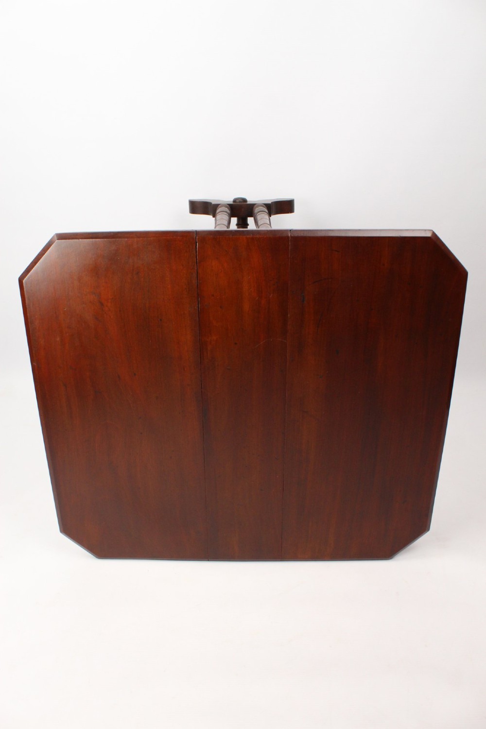 A small Victorian mahogany Sutherland table shown folded with two drop leaves, slender turned spindle legs, and a low stretcher base. View XII