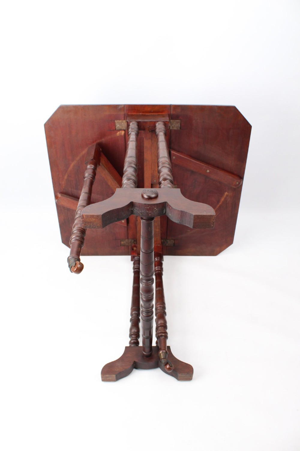 A small Victorian mahogany Sutherland table shown folded with two drop leaves, slender turned spindle legs, and a low stretcher base. View XIII
