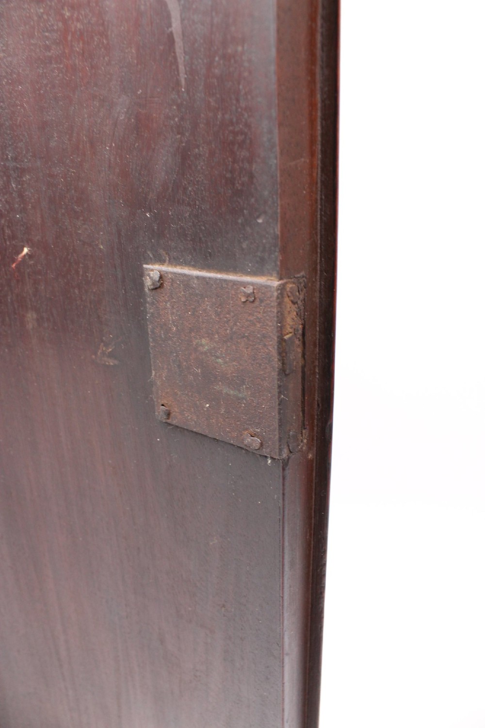 A Georgian mahogany bow front corner cupboard with twin curved doors and decorative brass hinges and keyhole escutcheons. View VIII