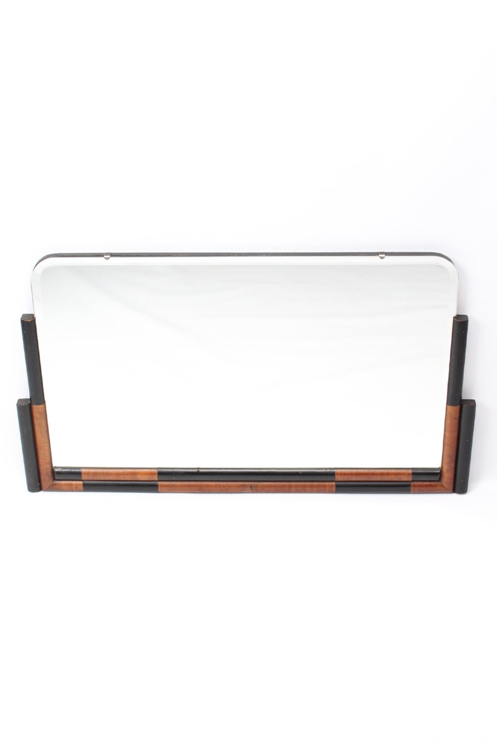 A horizontal rectangular Art Deco wall mirror featuring rounded top corners and a lower frame constructed with alternating walnut and ebonised timber sections.