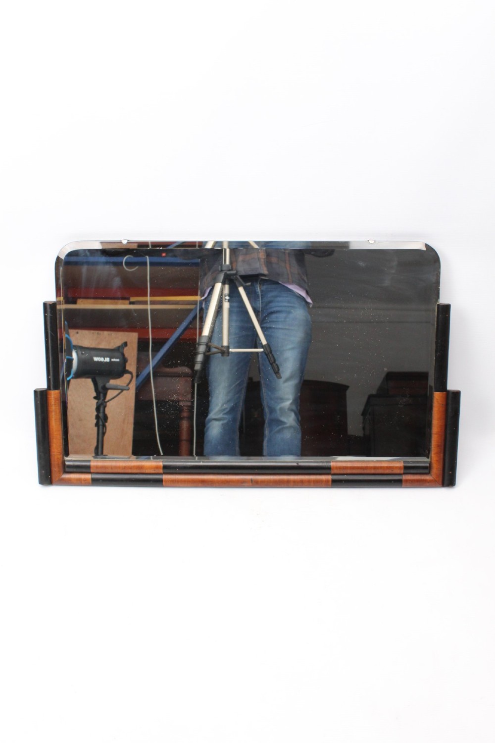 A horizontal rectangular Art Deco wall mirror featuring rounded top corners and a lower frame constructed with alternating walnut and ebonised timber sections. View II