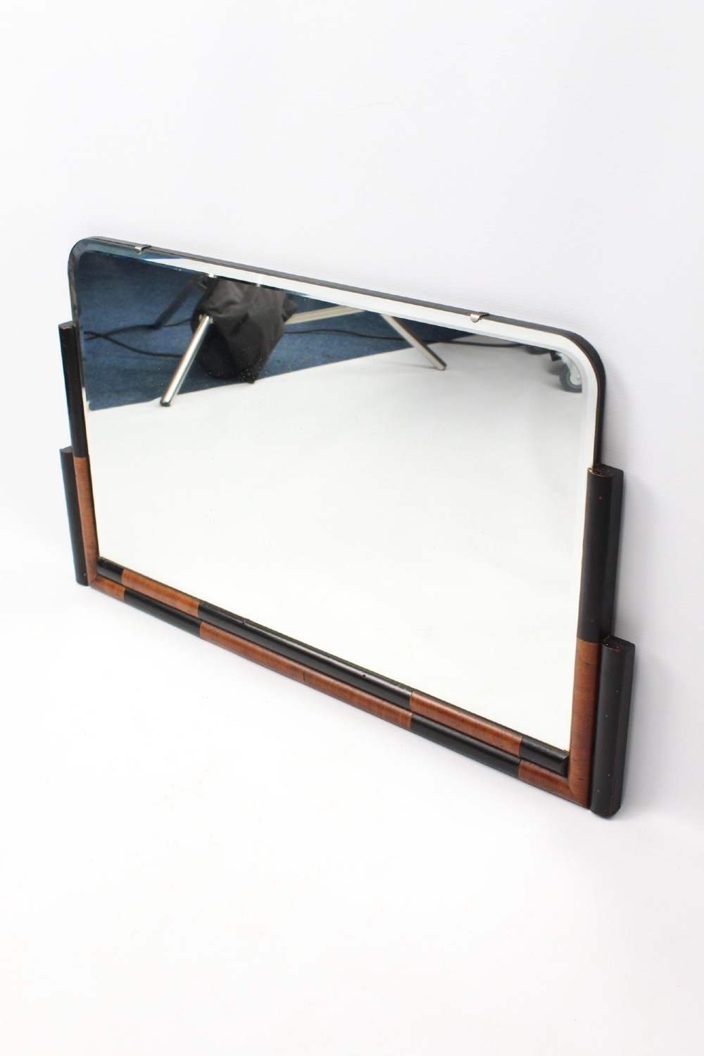 A horizontal rectangular Art Deco wall mirror featuring rounded top corners and a lower frame constructed with alternating walnut and ebonised timber sections. View III