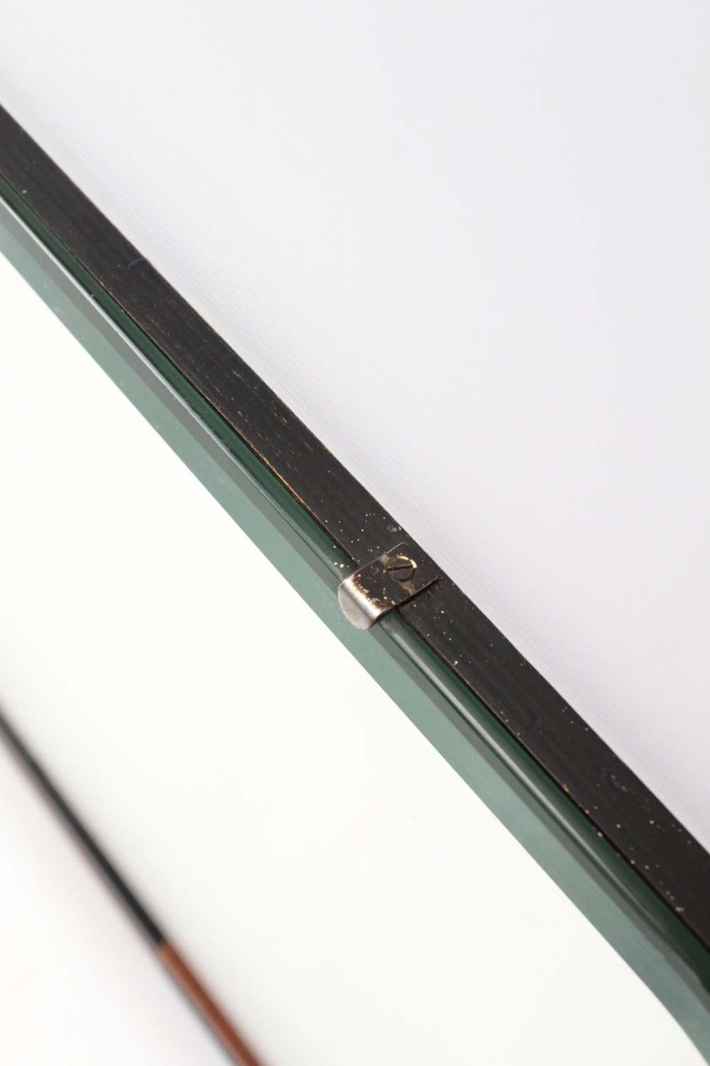 A horizontal rectangular Art Deco wall mirror featuring rounded top corners and a lower frame constructed with alternating walnut and ebonised timber sections. View IV