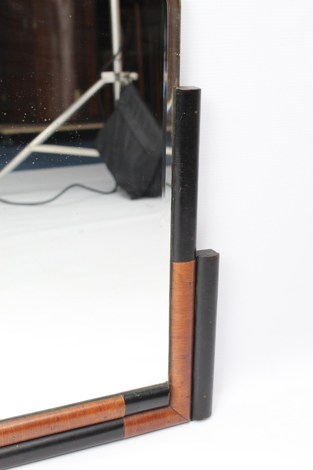 A horizontal rectangular Art Deco wall mirror featuring rounded top corners and a lower frame constructed with alternating walnut and ebonised timber sections. View VIII