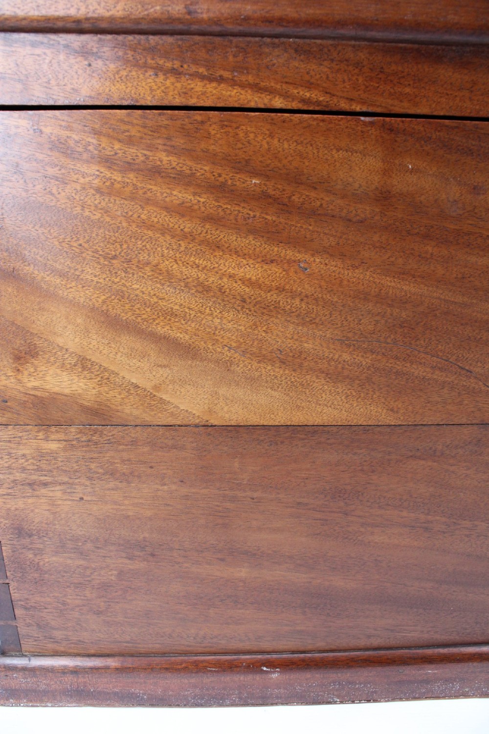 A rectangular Victorian mahogany storage chest featuring exposed dovetail corner joints, a flat hinged lid, and a central brass handle. View XI