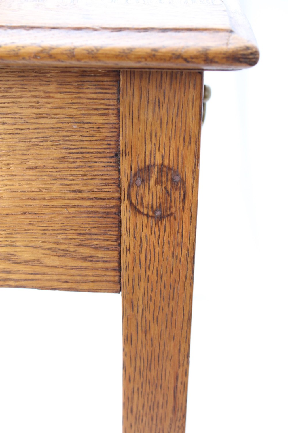 A late Victorian Arts and Crafts oak writing desk featuring drawers with brass swan-neck handles and tapered square legs. View XII